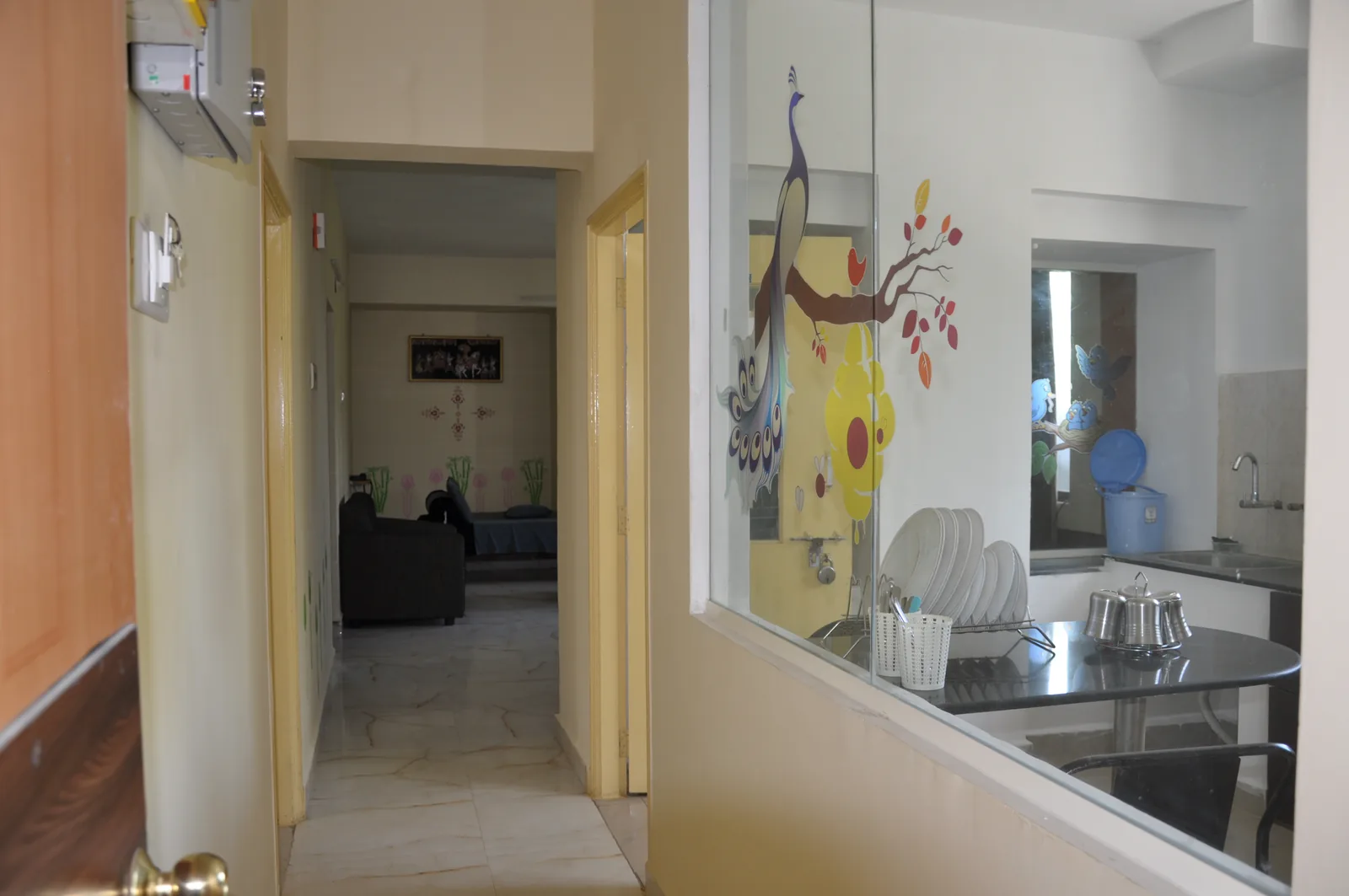 Kitchen and dining area seen from the apartment hallway